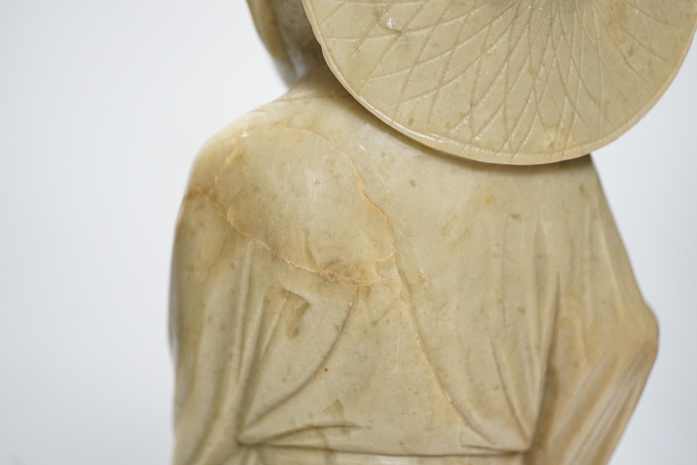 A tall Chinese soapstone figure of a fisherman, 40cm high. Condition - good